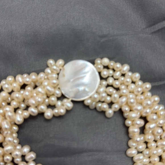 Salt Water Pearl Necklace
6 strand / 18 inches 
Magnetic mother of pearl clasp - Picture 3 of 7